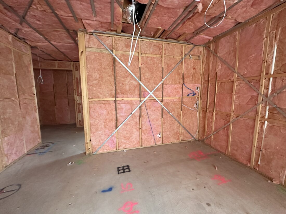 Wall wrap and ceiling insulation complete on a timber framed room, ready for plaster